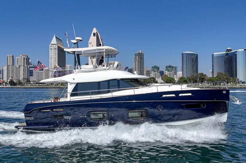 Slide: The Image of Azimut Magellano 50 yacht cruising near city skyline, 2013 model. - 21