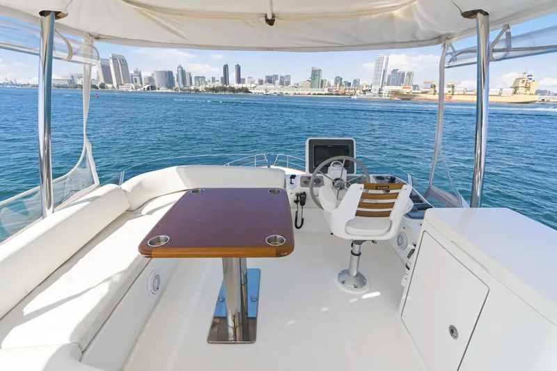 Slide: The Image of Flybridge of 2013 Azimut Magellano 50 yacht with city skyline view. - 23