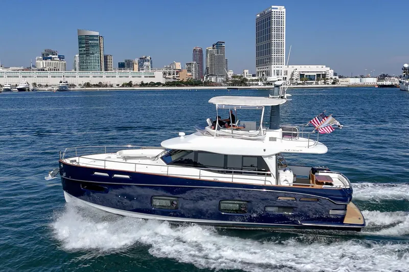 Slide: The Image of Azimut Magellano 50 yacht cruising near city skyline, 2013 model. - 25