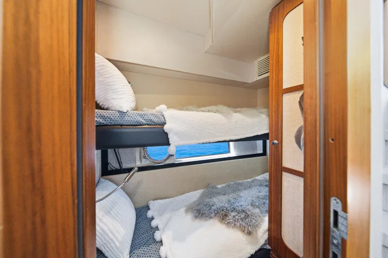 Slide: The Image of Cozy bunk beds in 2013 Azimut Magellano 50 yacht cabin with ocean view. - 26