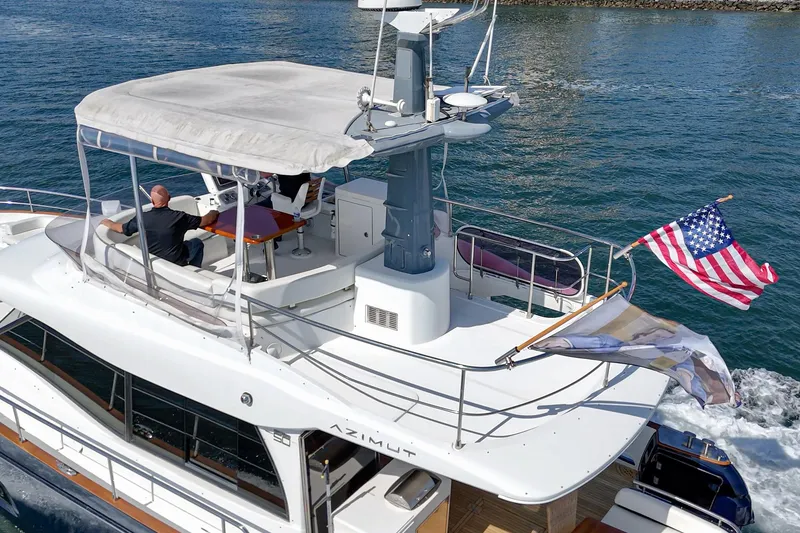 Slide: The Image of Azimut Magellano 50 yacht cruising with American flag, 2013 model. - 30