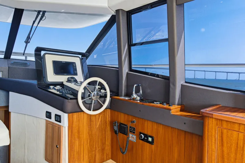 Slide: The Image of Interior helm of 2013 Azimut Magellano 50 yacht with steering wheel and navigation equipment. - 33