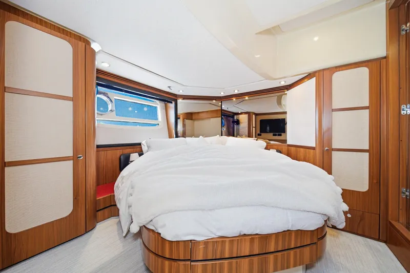Slide: The Image of Luxurious bedroom interior of 2013 Azimut Magellano 50 yacht with elegant wood finishes. - 34