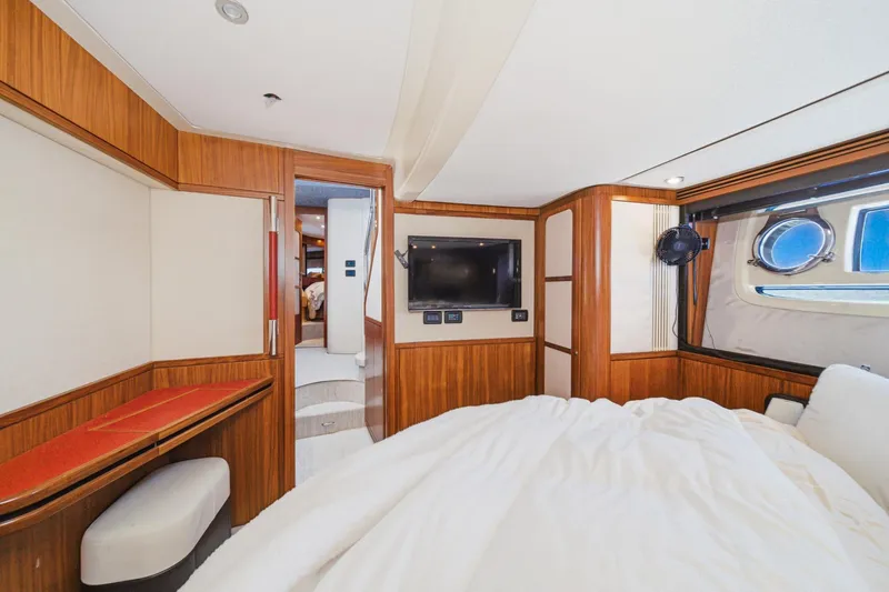 Slide: The Image of Luxurious cabin interior of 2013 Azimut Magellano 50 yacht with wood paneling and porthole window. - 35