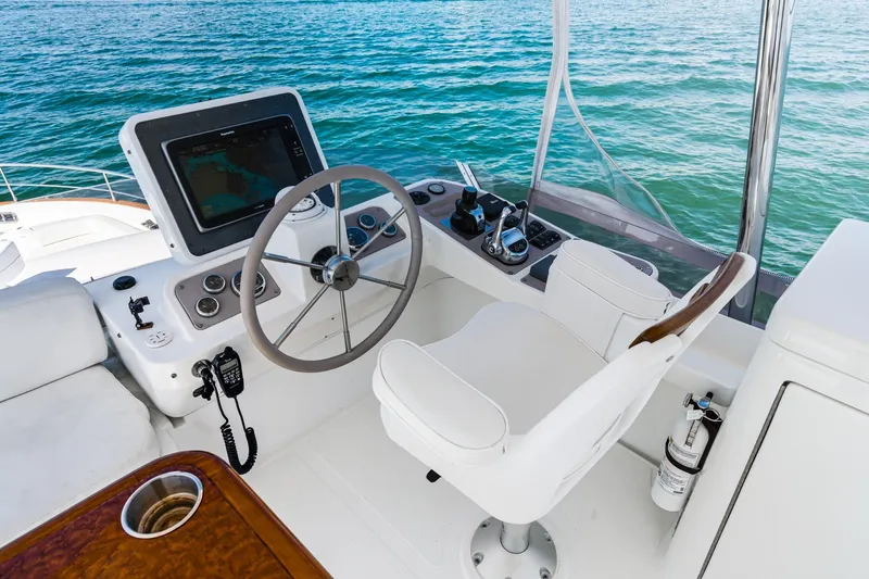 Slide: The Image of Helm of 2013 Azimut Magellano 50 yacht with steering wheel and navigation equipment. - 37