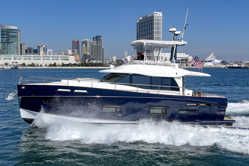 Slide: The Image of Azimut Magellano 50 yacht cruising near city skyline, 2013 model. - 39