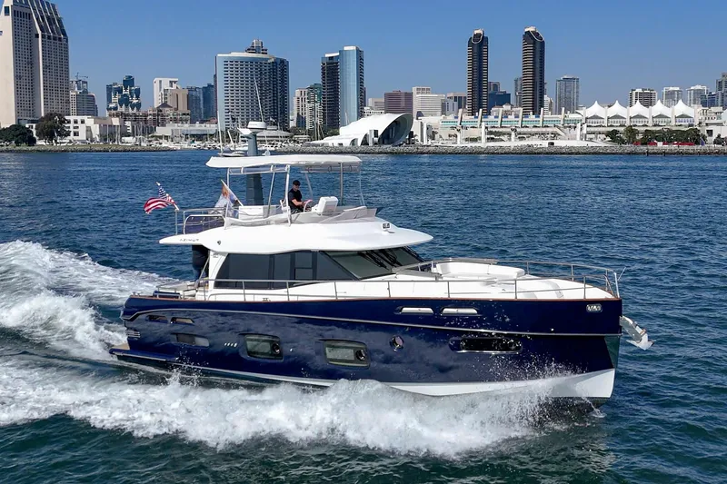 Slide: The Image of Azimut Magellano 50 yacht cruising near city skyline, 2013 model. - 46