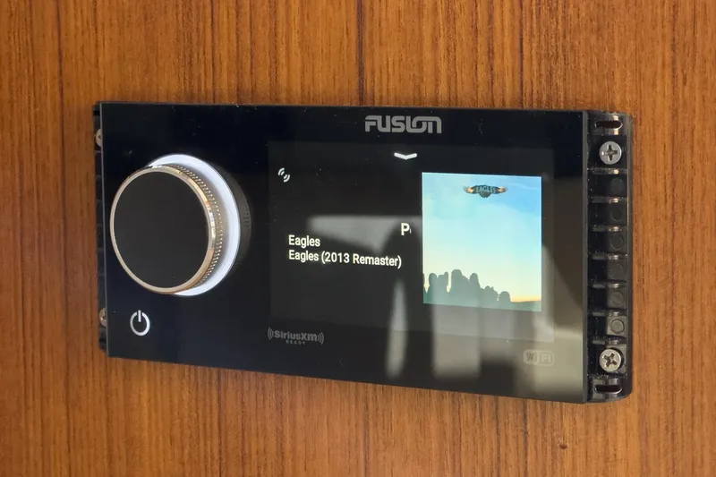 Slide: The Image of Fusion stereo system on Azimut Magellano 50 yacht, displaying Eagles album. - 48