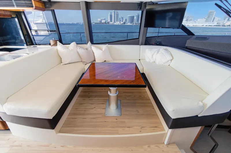 Slide: The Image of Luxurious interior of 2013 Azimut Magellano 50 yacht with elegant seating and cityscape view. - 5