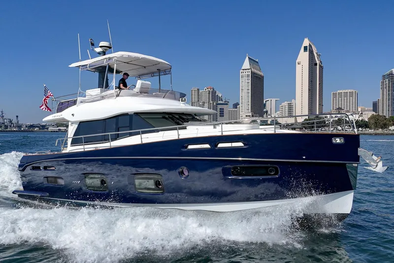 Slide: The Image of Azimut Magellano 50 yacht cruising near city skyline, 2013 model. - 53