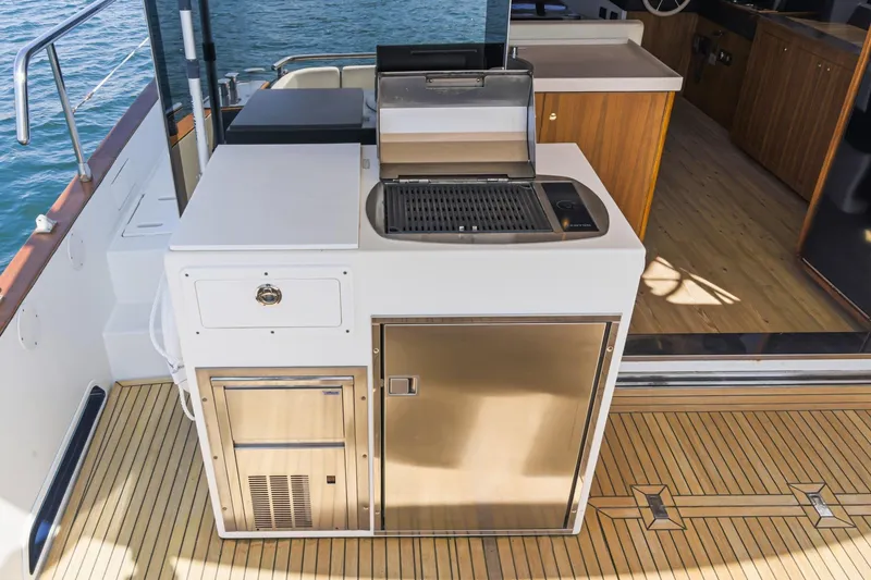 Slide: The Image of Outdoor kitchen on 2013 Azimut Magellano 50 yacht with grill and storage. - 60