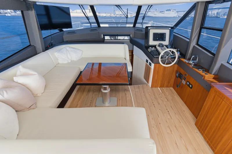 Slide: The Image of Luxurious interior of 2013 Azimut Magellano 50 yacht with elegant seating and navigation area. - 61