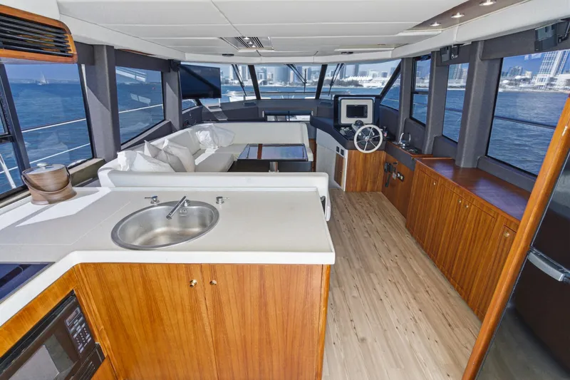 Slide: The Image of Luxurious interior of 2013 Azimut Magellano 50 yacht with modern kitchen and seating area. - 63