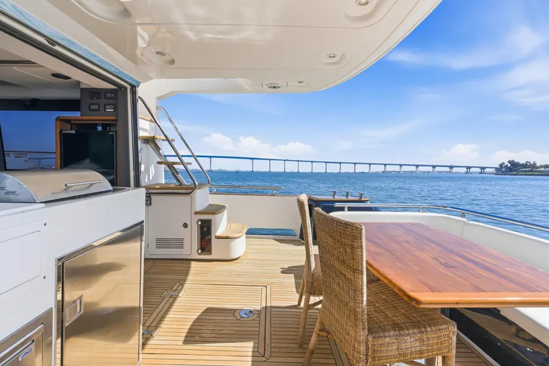 Slide: The Image of Luxurious 2013 Azimut Magellano 50 yacht deck with ocean view and elegant seating. - 64