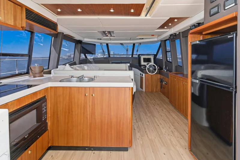 Slide: The Image of Luxurious interior of 2013 Azimut Magellano 50 yacht with modern kitchen and helm. - 65