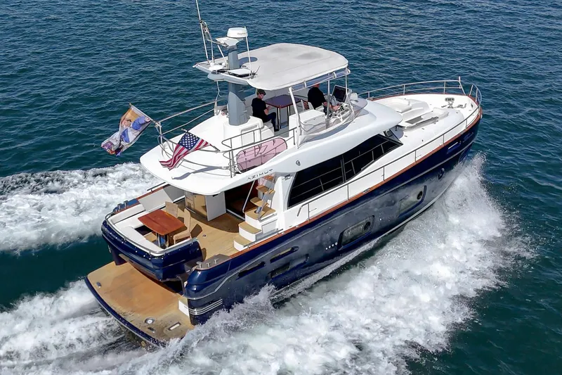 Slide: The Image of 2013 Azimut Magellano 50 yacht cruising on open water, rear view. - 67