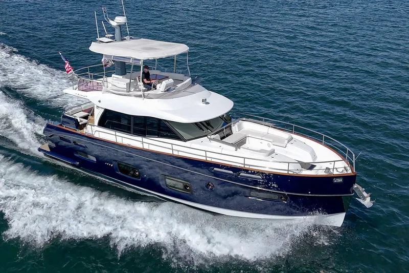 Slide: The Image of 2013 Azimut Magellano 50 yacht cruising on open water. - 68