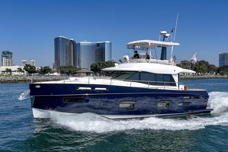 Slide: The Image of Azimut Magellano 50 yacht cruising near city skyline, 2013 model. - 74