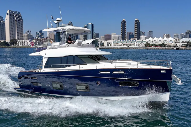 Slide: The Image of 2013 Azimut Magellano 50 yacht cruising near city skyline. - 81