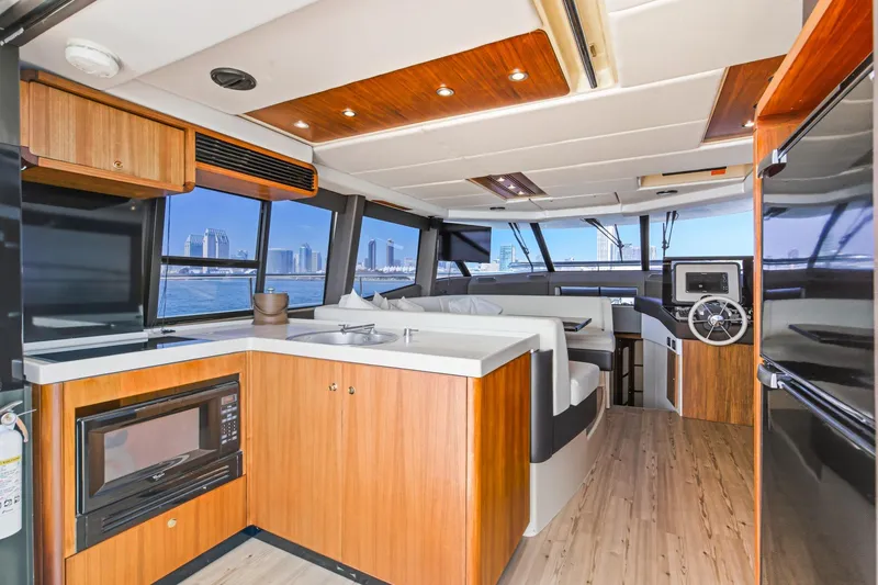 Slide: The Image of Luxurious interior of 2013 Azimut Magellano 50 yacht with modern kitchen and seating area. - 82