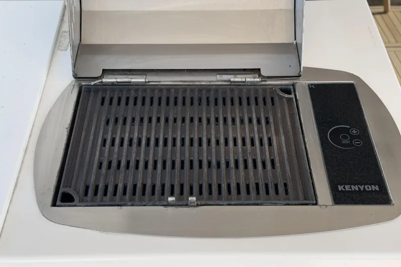 Slide: The Image of Kenyon grill on 2013 Azimut Magellano 50 yacht, featuring sleek stainless steel design. - 83