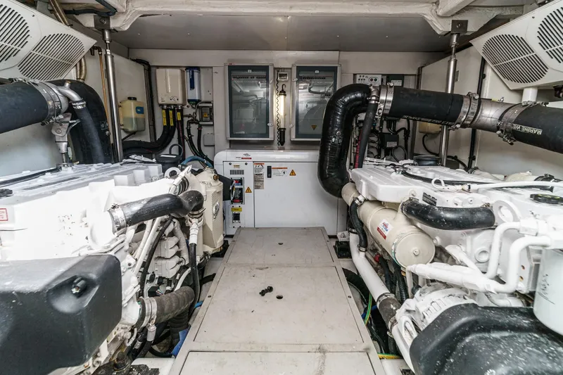 Slide: The Image of Engine room of 2013 Azimut Magellano 50 yacht, featuring dual engines and control systems. - 85