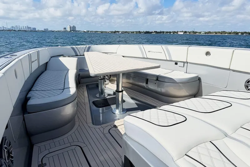 Slide: The Image of Luxurious seating area on a Midnight Express 43 Open boat with ocean view. - 10