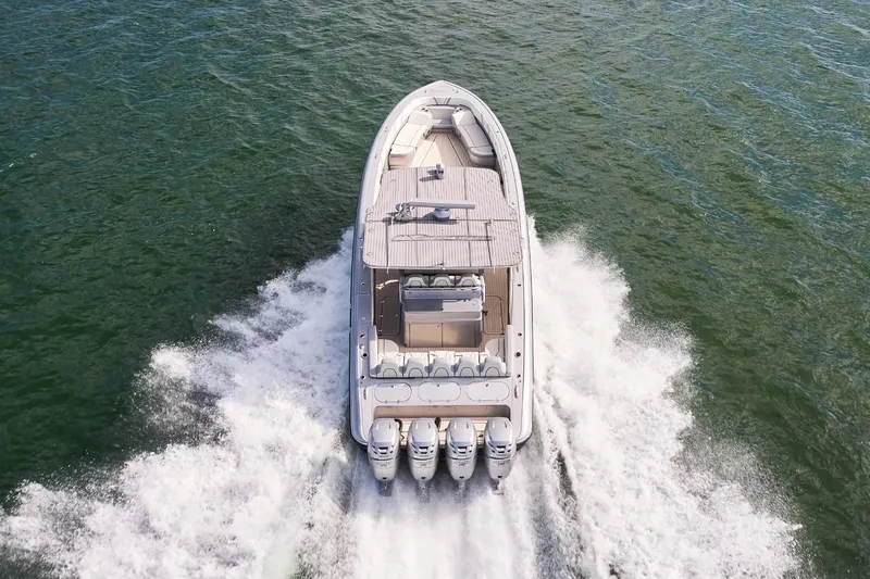 Slide: The Image of Aerial view of Midnight Express 43 Open boat speeding on water. - 3