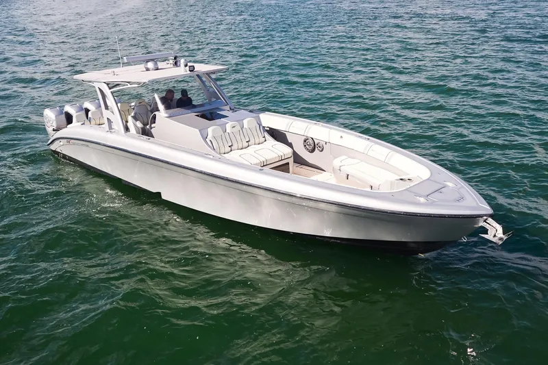 Slide: The Image of Midnight Express 43 Open boat cruising on open water, showcasing sleek design and powerful engines. - 4