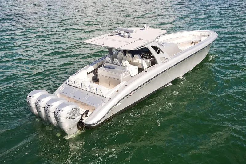 Slide: The Image of Midnight Express 43 Open boat with four engines cruising on the water. - 5