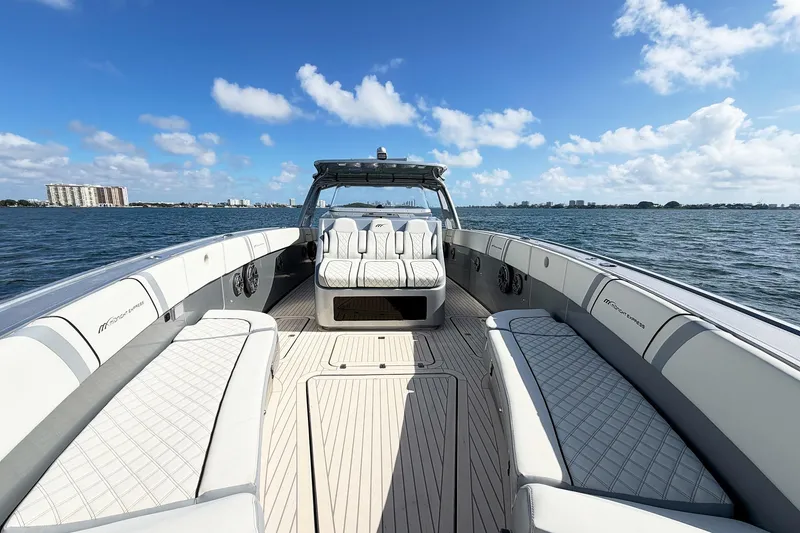 Slide: The Image of Luxury Midnight Express 43 Open boat on water, featuring spacious seating and sleek design. - 7