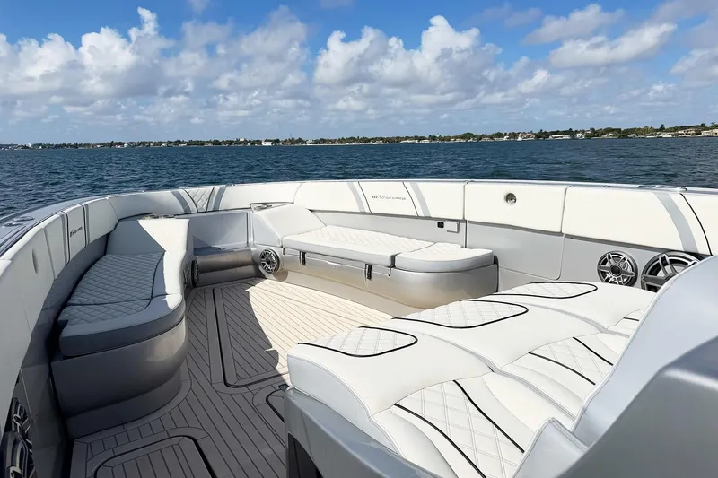 Slide: The Image of Luxurious seating on a Midnight Express 43 Open boat with ocean view and blue sky. - 9