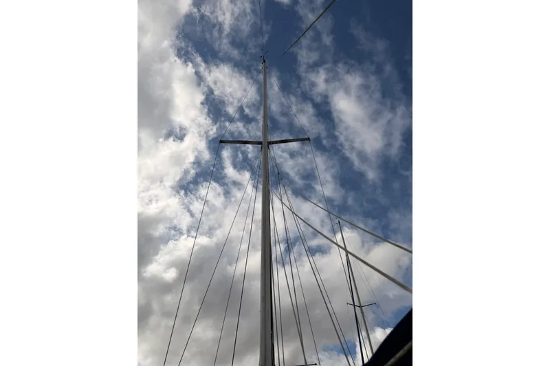 Slide: The Image of Mast of 1989 Catalina 34 sailboat against a cloudy sky. - 11