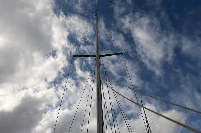 Slide: The Image of Mast of 1989 Catalina 34 sailboat against a cloudy sky. - 12