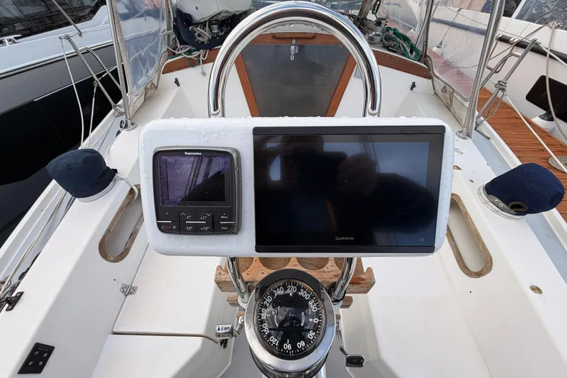 Slide: The Image of Cockpit of 1989 Catalina 34 sailboat with navigation instruments and compass. - 8