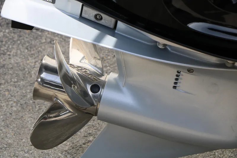 Slide: The Image of Close-up of a 2019 Crestliner VT 18 boat propeller, showcasing its metallic finish. - 14