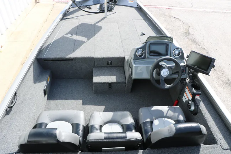 Slide: The Image of 2019 Crestliner VT 18 boat interior with steering console and seating. - 16