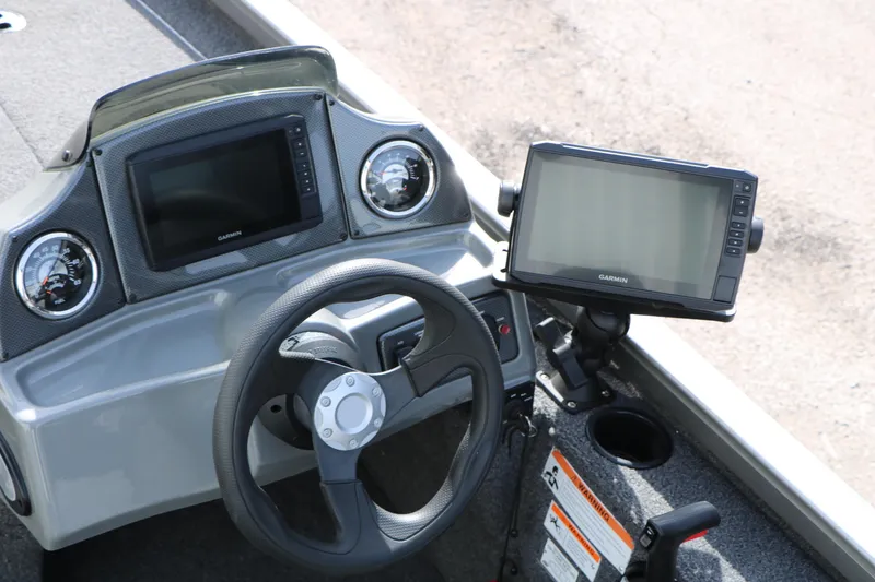 Slide: The Image of 2019 Crestliner VT 18 boat dashboard with Garmin displays and steering wheel. - 25