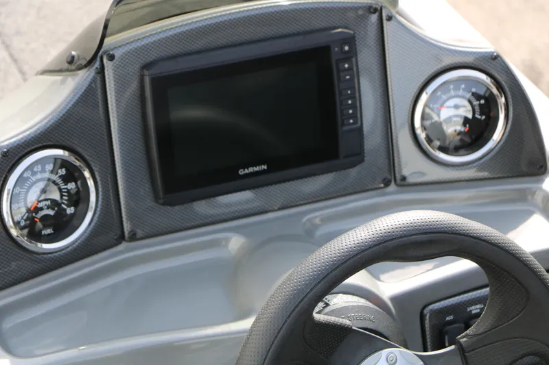 Slide: The Image of 2019 Crestliner VT 18 dashboard with Garmin display and gauges. - 27