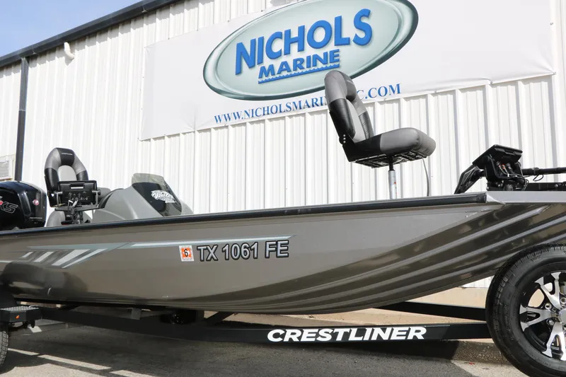 Slide: The Image of 2019 Crestliner VT 18 boat at Nichols Marine dealership, featuring sleek design and modern seating. - 34