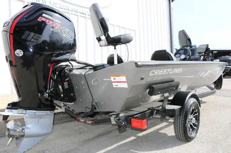 Slide: The Image of 2019 Crestliner VT 18 boat with Mercury Pro XS engine, parked on a trailer. - 7