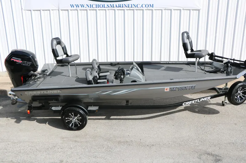 Slide: The Image of 2019 Crestliner VT 18 fishing boat with Mercury Pro XS engine, displayed on trailer. - 8