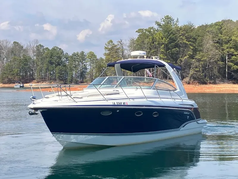 The Image of 2006 Formula 31 Performance Cruiser on a serene lake. - 0