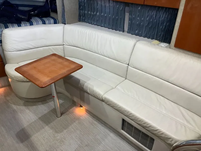 Slide: The Image of Interior of a 2006 Formula 31 Performance Cruiser with leather sofa and wooden table. - 15