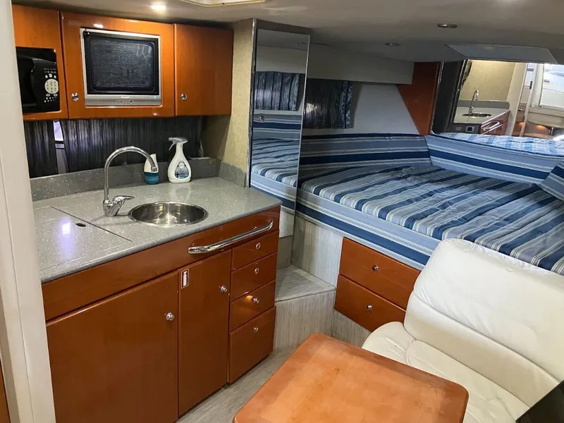 Slide: The Image of Interior of a 2006 Formula 31 Performance Cruiser with kitchenette and sleeping area. - 16