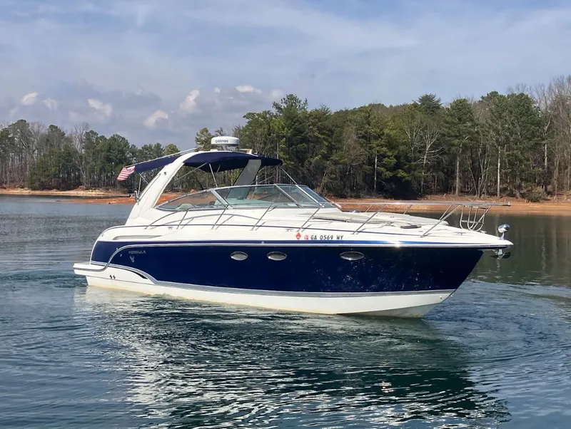 Slide: The Image of 2006 Formula 31 Performance Cruiser on a calm lake. - 3