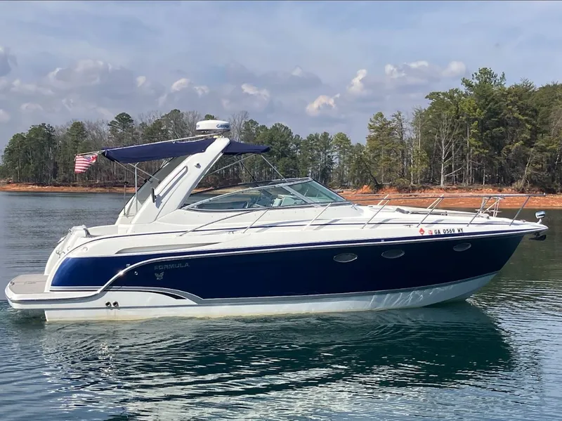 Slide: The Image of 2006 Formula 31 Performance Cruiser on a calm lake. - 4