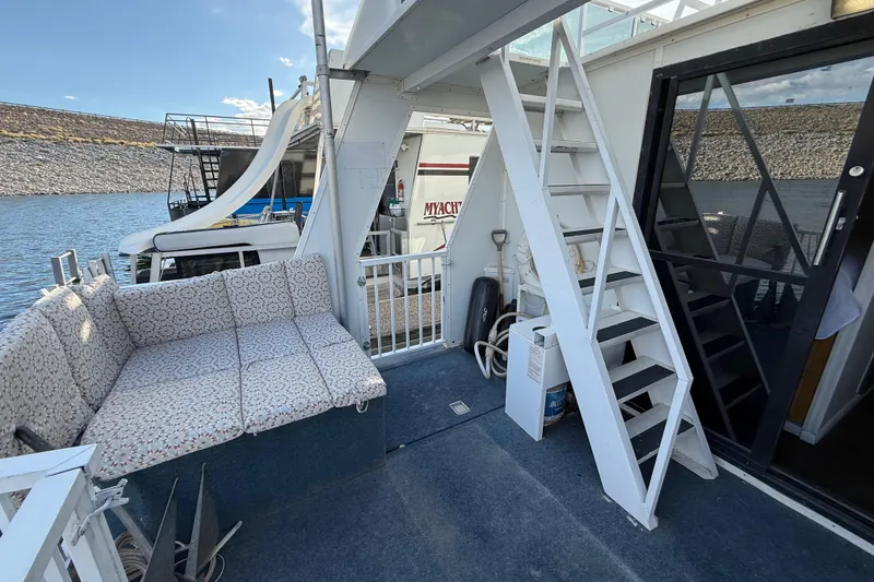 Slide: The Image of Houseboat deck with stairs, seating, and water view, Fun Country 5014 SunCountry Arizona Edition, 2006. - 20