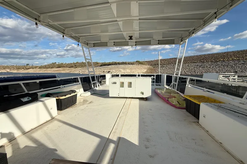 Slide: The Image of 2006 Fun Country 5014 SunCountry Arizona Edition houseboat deck with canopy and scenic view. - 27