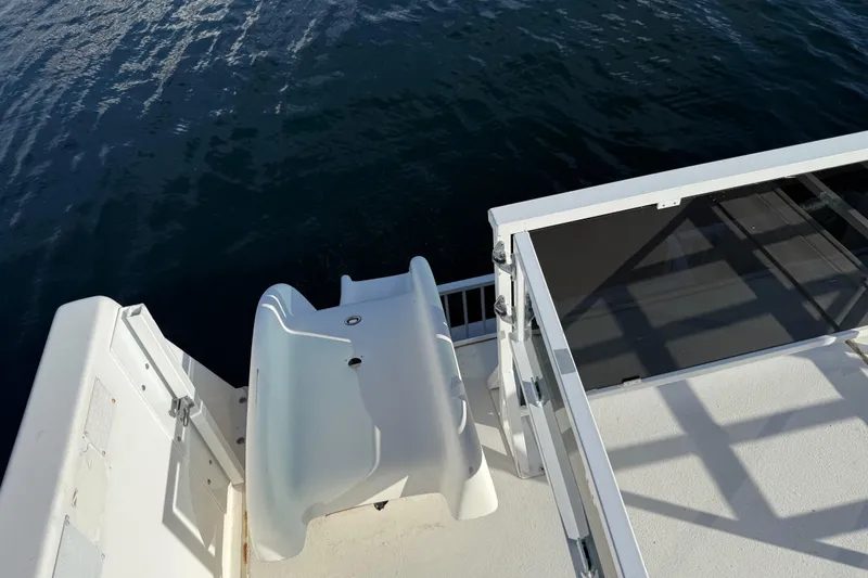 Slide: The Image of Houseboat slide on 2006 Fun Country 5014 SunCountry Arizona Edition, overlooking water. - 28